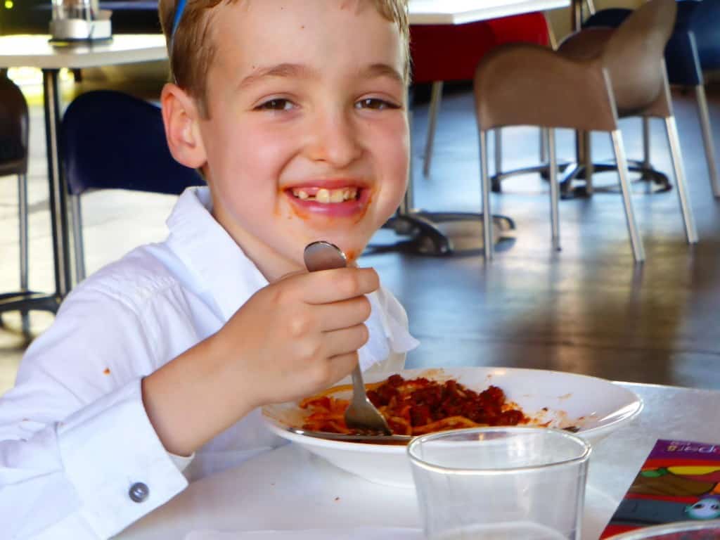 Child friendly dining at The Belvedere Hotel Redcliffe, North Brisbane. Boy eats spaghetti